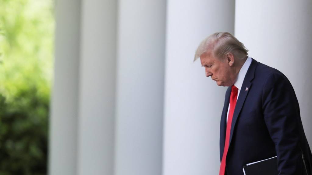 Donald Trump walks to the White House Rose garden, 27 April