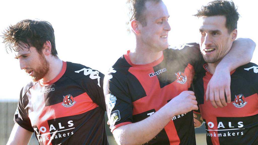 Crusaders players celebrate victory over Glenavon