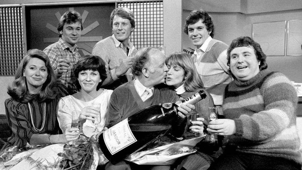 Weatherman Francis Wilson, Nick Ross and David Icke. Front row: Jane Pauley, an American who runs her own breakfast show, Debbie Rix, Frank Bough kissing Selina Scott and astrologer Russell Grant.