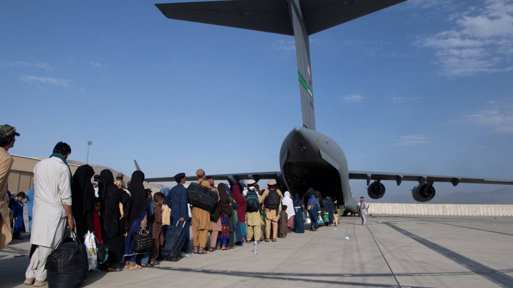 Passengers boarding US Air Force plane at Hamid Karzai International Airport in Kabul, Afghanistan, August 24, 2021