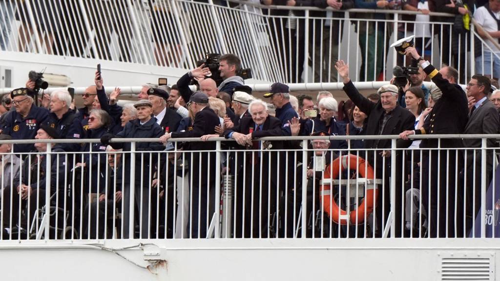 Normandy veterans wave from on board the Brittany Ferries ship Mont St Michel as it sets sail from Portsmouth Harbour in the UK to Ouistreham, in Caen, France, carrying 31 D-Day and Normandy veterans who are travelling with the Royal British Legion and Spirit of Normandy Trust to take part in commemorations to mark the 80th anniversary of D-Day