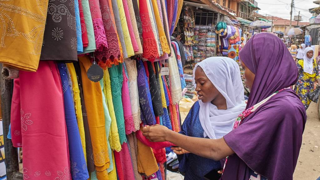 People shopping at a market in Lagos, Nigeria - May 2022