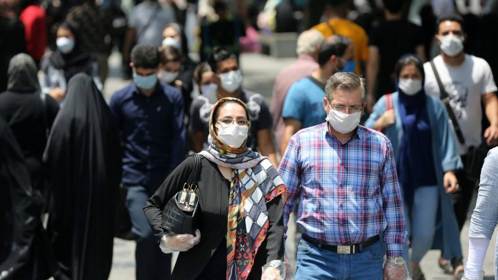 Coronavirus: Iran 'cannot afford' shutdown over virus - Rouhani - BBC News