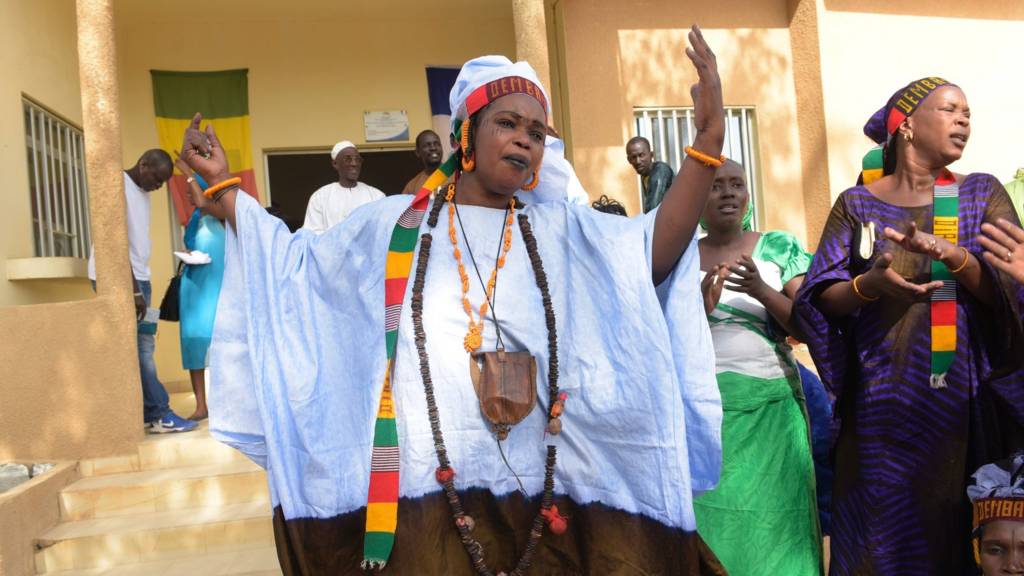 A picture taken on November 13, 2015 shows women from the Thiouballo tribe dancing and singing during the visit of the French Ambassador to Senegal, in the Matam town hall, northern Senegal.
