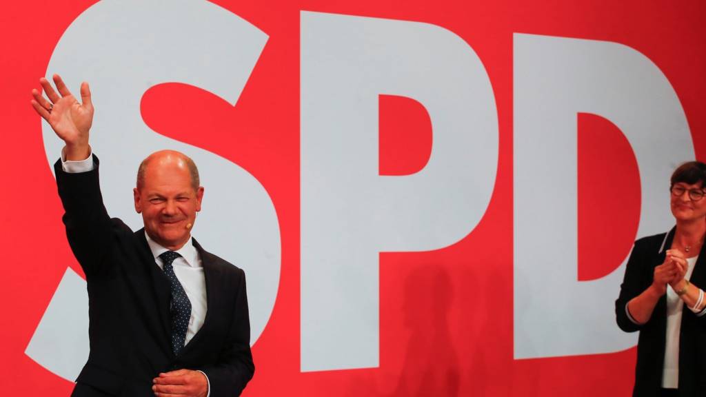 Social Democratic Party (SPD) leader and top candidate for chancellor Olaf Scholz and party co-leader Saskia Esken react after first exit polls for the general elections in Berlin, Germany, September 26, 2021