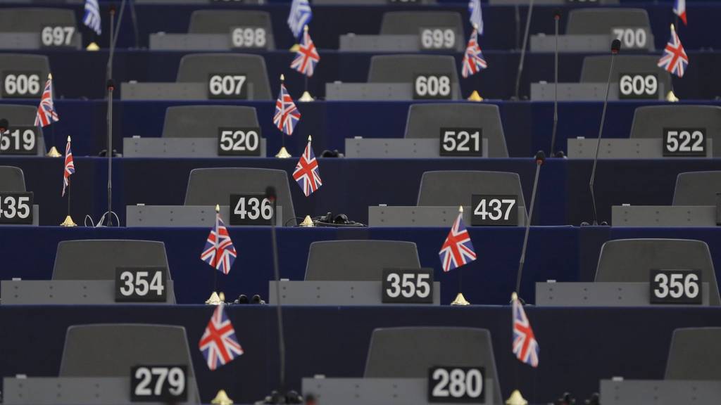 UK flags on desks in the European Parliament