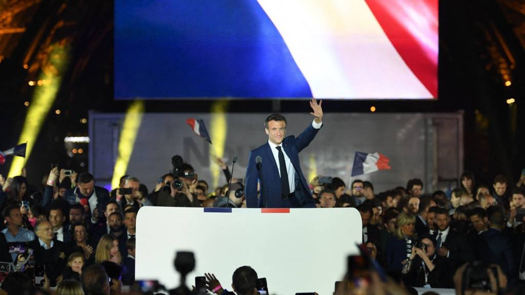 French President and La Republique en Marche (LREM) party candidate for re-election Emmanuel Macron celebrates after his victory in France's presidential election, at the Champ de Mars in Paris, on April 24, 2022