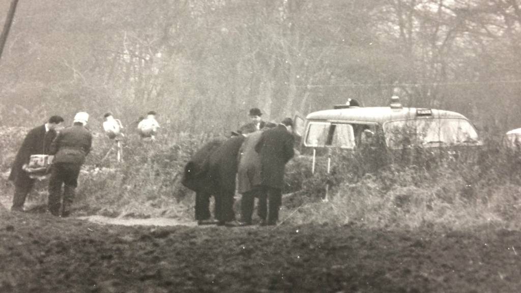 Police searching a field