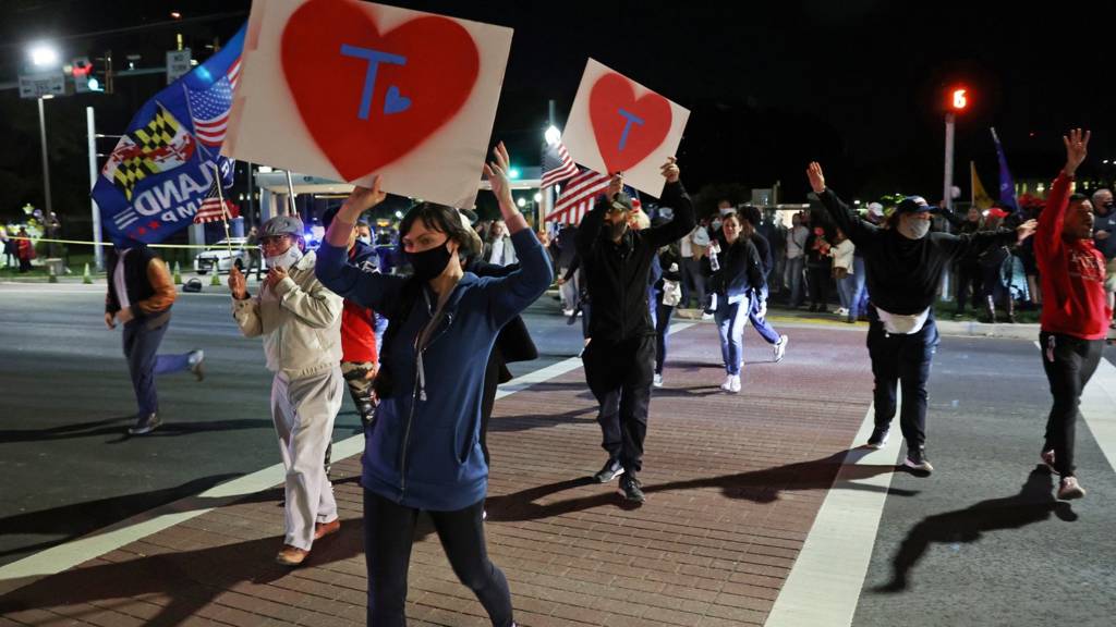Supporters rally at a vigil for U.S. President Donald Trump outside of Walter Reed National Military Medical Center, where he is being treated for coronavirus disease (COVID-19) in Bethesda, Maryland, U.S. October 3