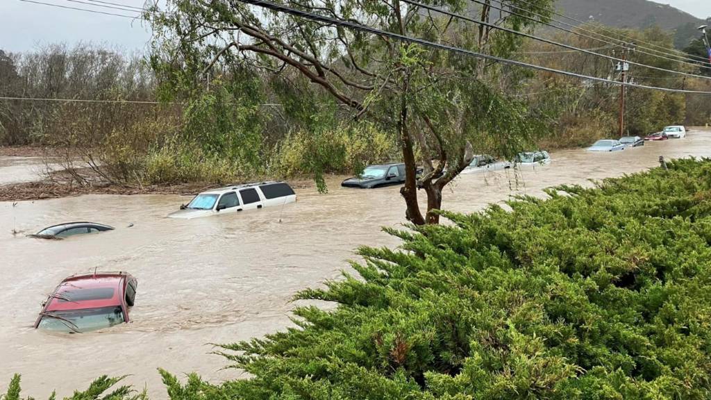 Cars submerged in flood waters in Morro Bay, California