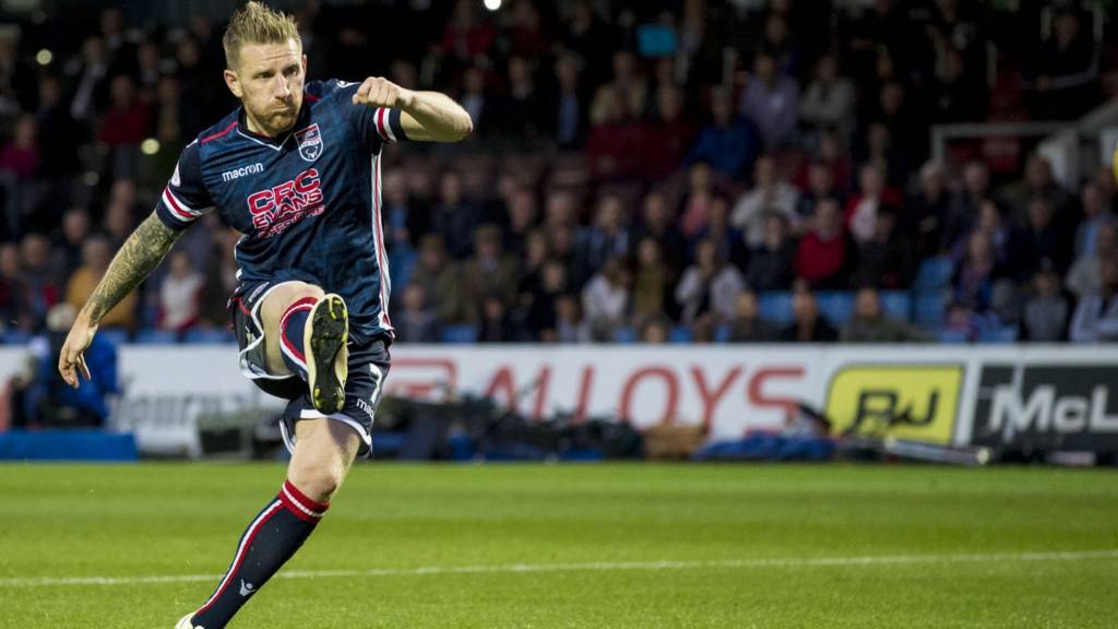 Michael Gardyne scores the winning penalty