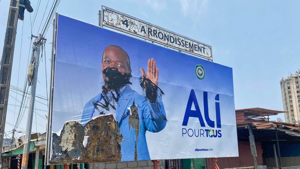 A defaced campaign billboard of ousted Gabon President Ali Bongo Ondimba in Libreville, Gabon - 31 August 2023