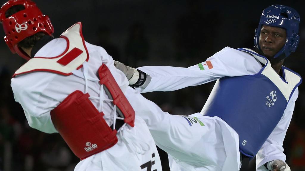 Issoufou Alfaga Abdoulrazak of Nigeria competes against Radik Isaev of Azerbaijan