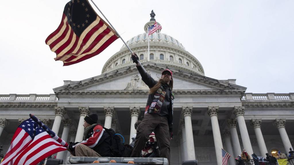 Pro-Trump protesters storm the grounds of the East Front of the US Capitol, in Washington, DC, USA, 06 January 2021. Various groups of Trump supporters have broken into the US Capitol and rioted as Congress prepares to meet and certify the results of the 2020 US Presidential election.