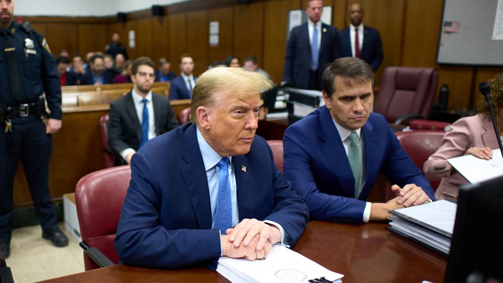 Former US President Donald Trump appears in court with his attorney Todd Blanche during his trial for allegedly covering up hush money payments at Manhattan Criminal Court on 26 April 2024 in New York City