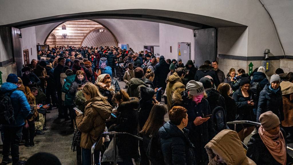 People are seen sheltering in the Kyiv metro system following a fresh wave of Russian strikes