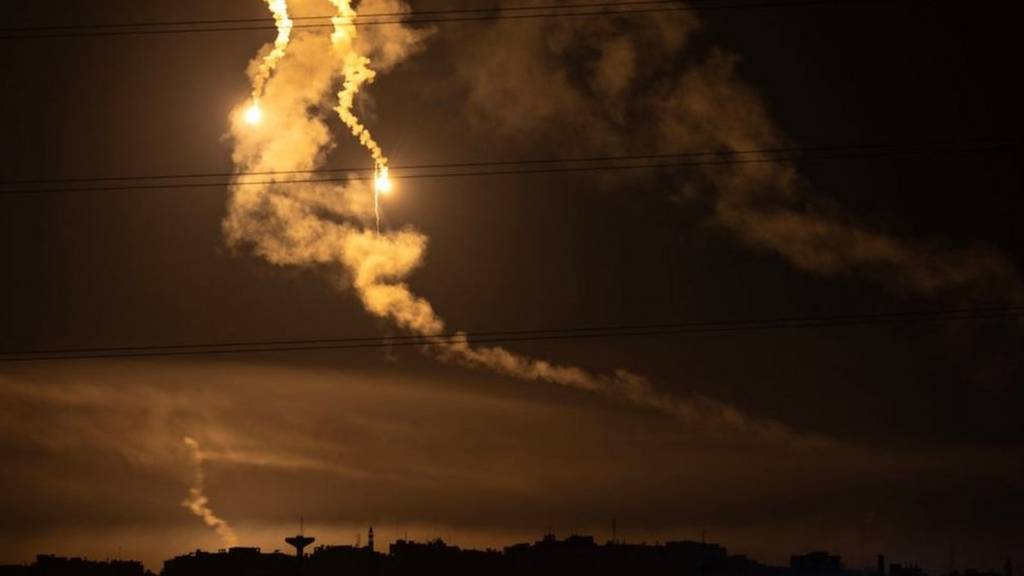 Flares light up the sky over the Gaza Strip