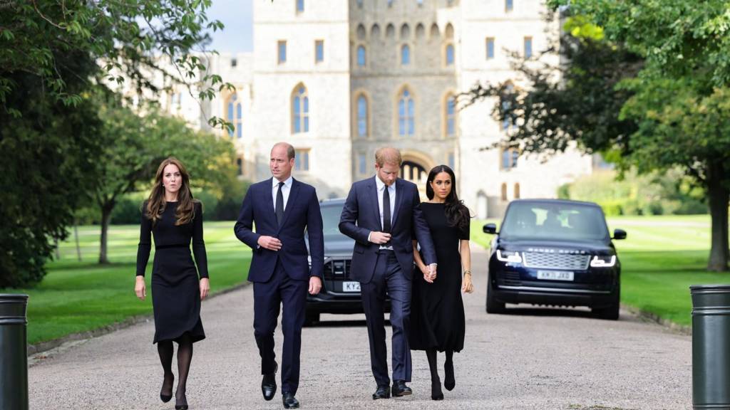 William, Prince of Wales, Catherine, Princess of Wales, Britain"s Prince Harry and Meghan, the Duchess of Sussex, walk outside Windsor Castle,