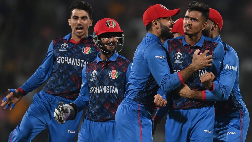 Afghanistan Cricket players celebrate together.