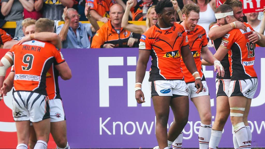 Castleford's players celebrate a try