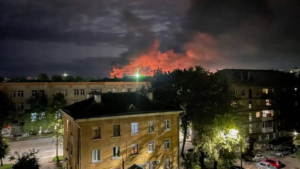 A handout photo made available by the Governor of Russian Pskov region Mikhail Vedernikov Telegram channel shows smoke billowing and explosions light after Russian militaries destroyed drones in Pskov, Pskov region, Russia