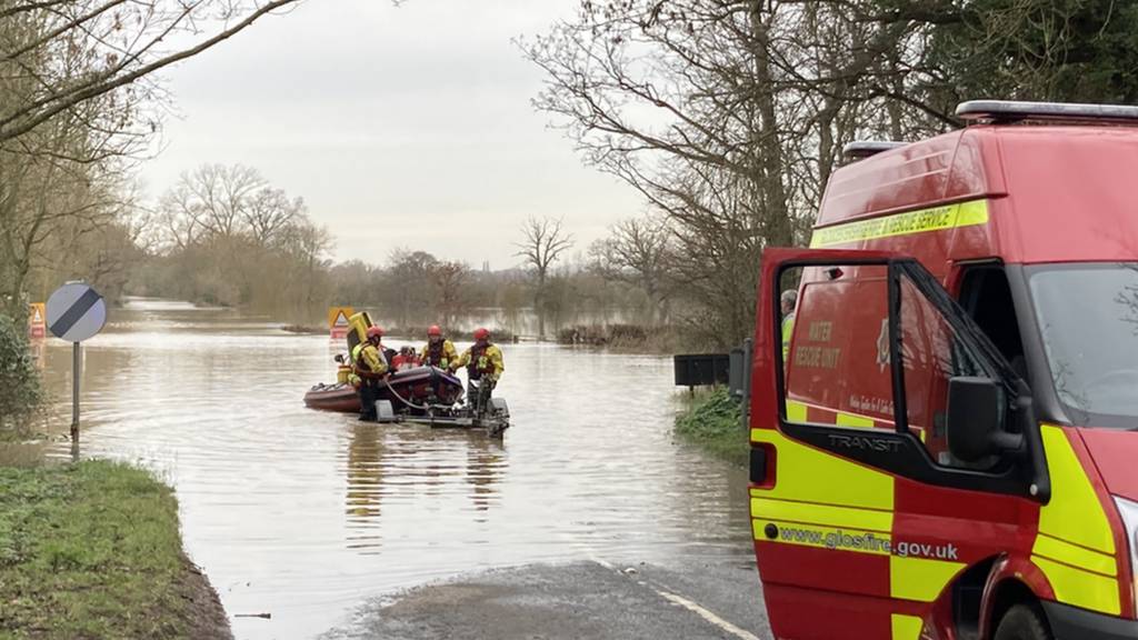 People being rescued from flooding