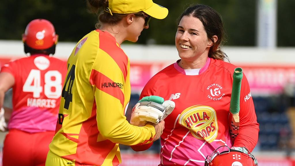 Nat Sciver-Brunt (left) congratulates Tammy Beaumont (right) for hitting a century