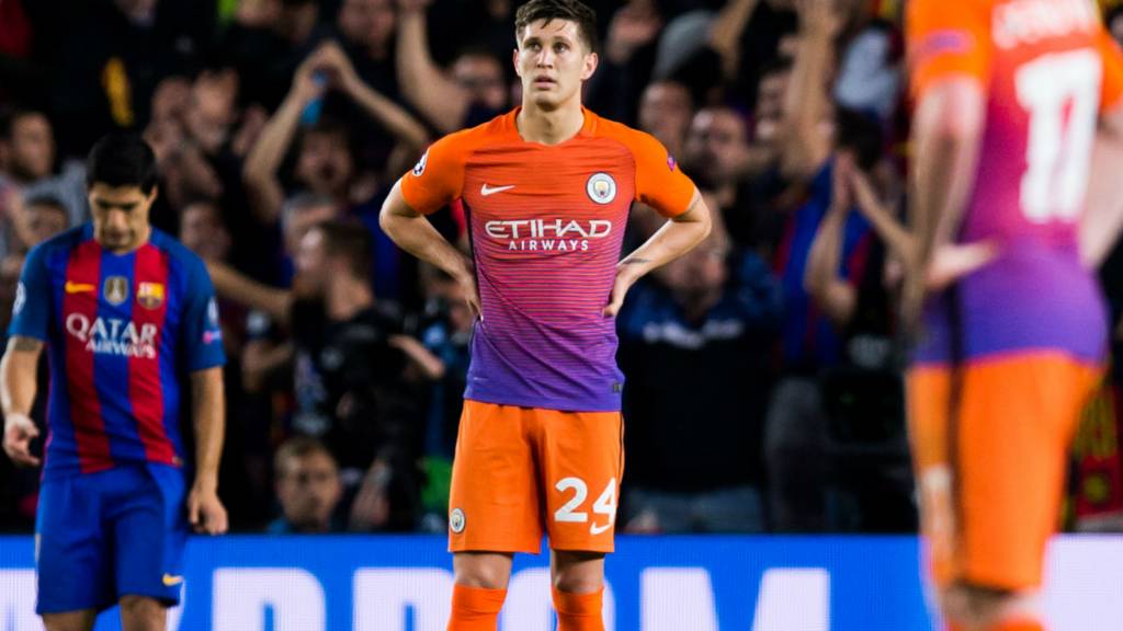 Man City's John Stones looks dejected