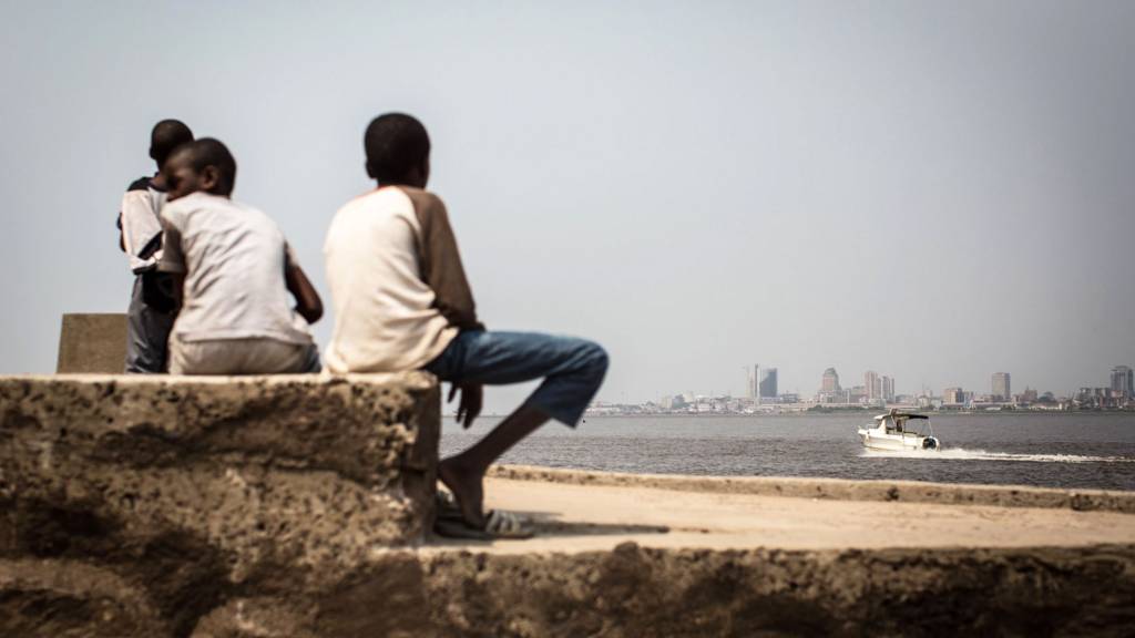 A group of children sit on the shores of the Congo river in Brazzaville, July 2015