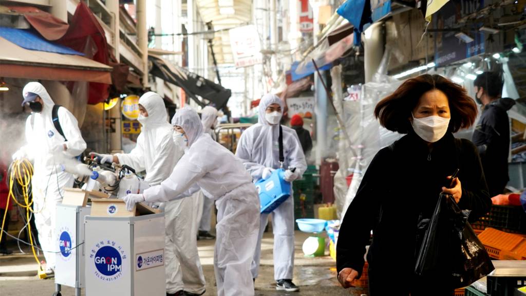 Woman walks in South Korea with mask