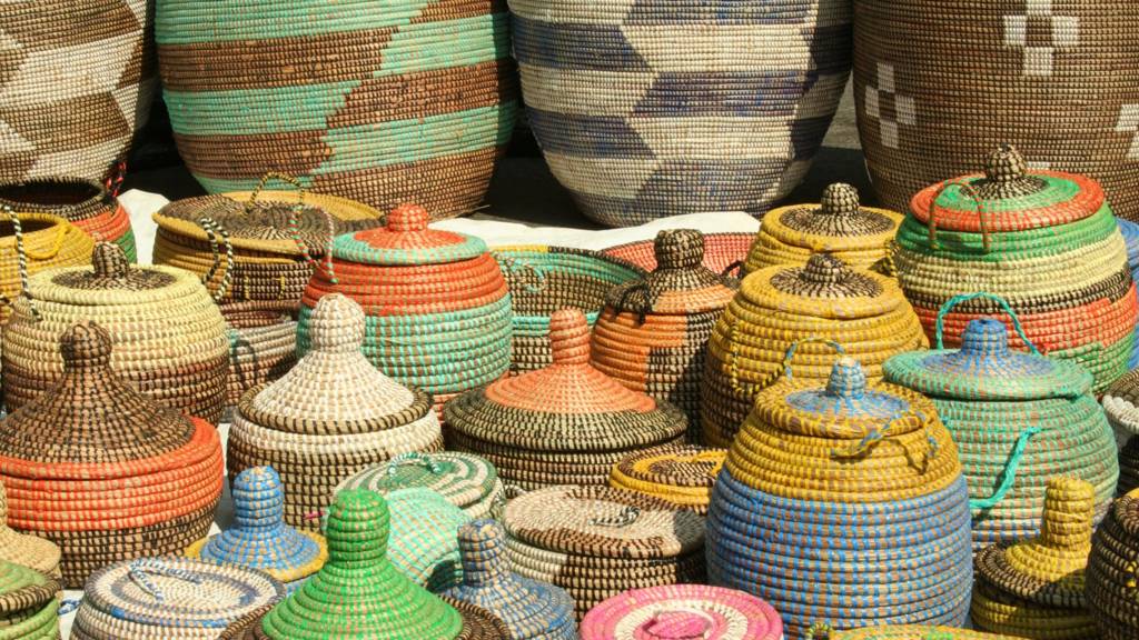 These colorful woven African seagrass storage baskets are handmade by women in Senegal, Congo, and Angola