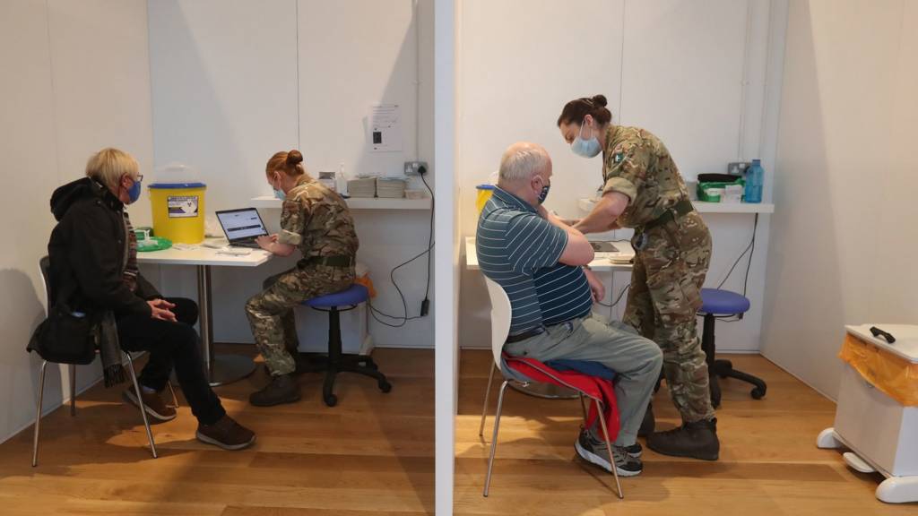 People being vaccinated at a vaccination centre near Edinburgh