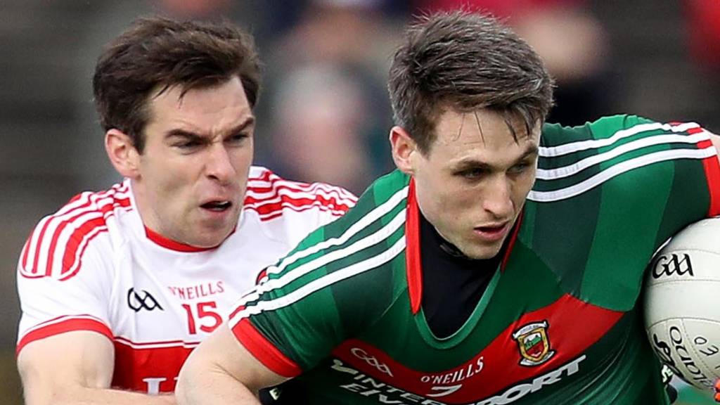 Derry's Benny Heron tackles Mayo's Patrick Durcan
