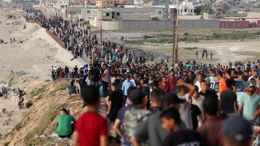 Queueing for aid from pier in Gaza