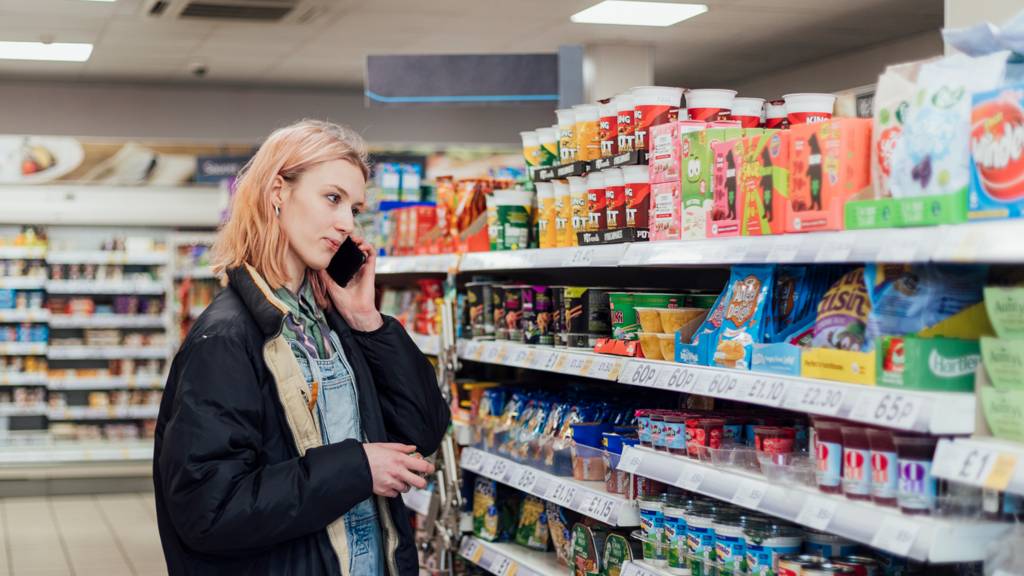 Stock image of a woman shopping for food