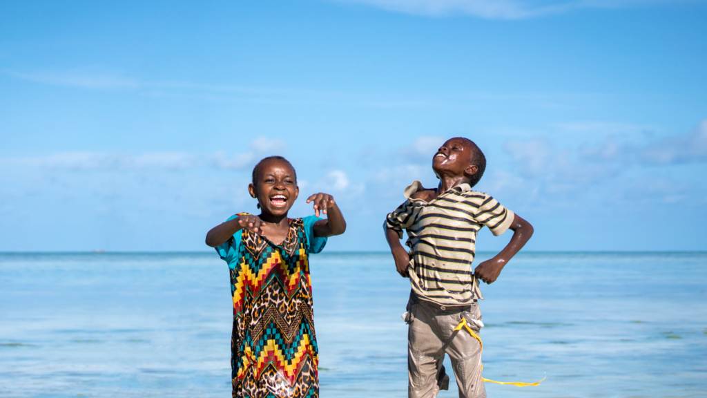 Children playing on a beach in Zanzibar, Tanzania