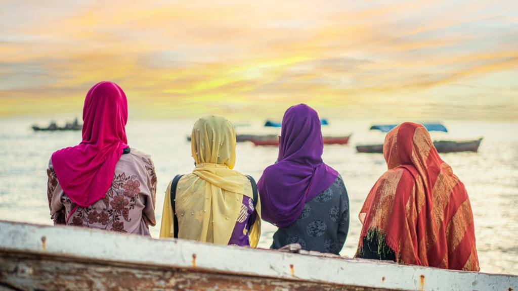 Women looking at a sunset in Tanzania