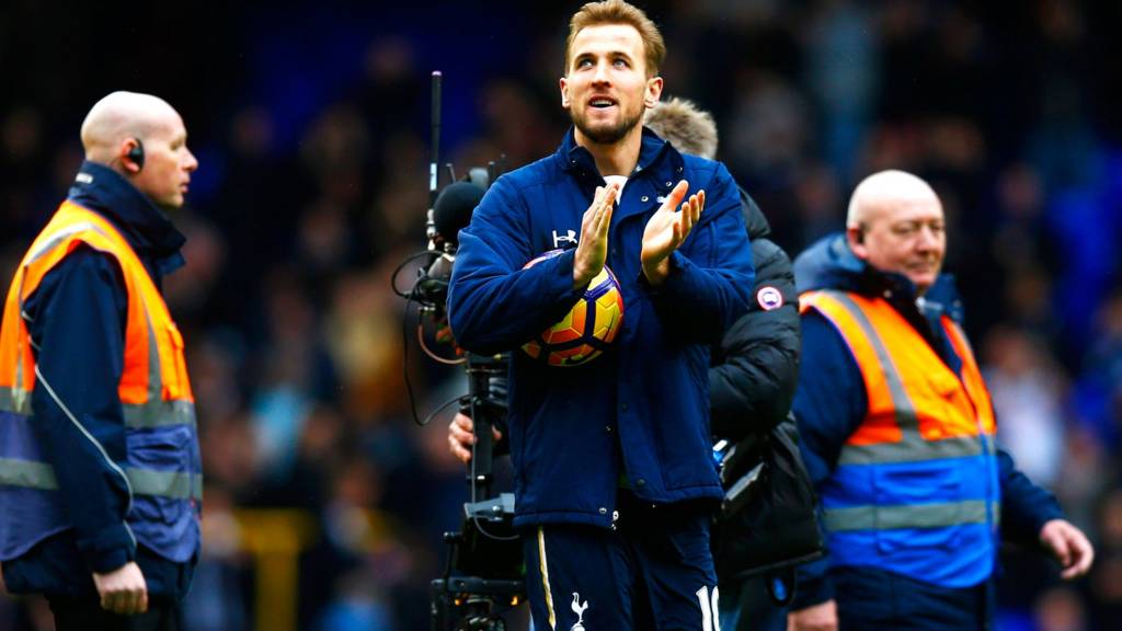 Harry Kane walks off with the match ball
