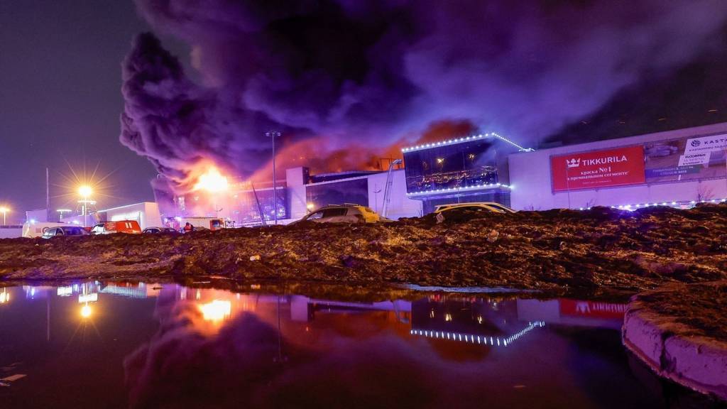 Smoke from fire rises above the burning Crocus City Hall concert venue following a shooting incident, outside Moscow, Russia, on 22 March 2024