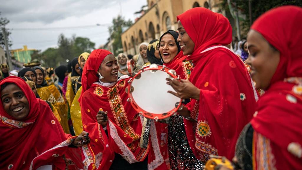 Young women dressed in traditional attires chant and dance during the celebration for the Shuwalid festival in Harar, Ethiopia - 16 April 2024