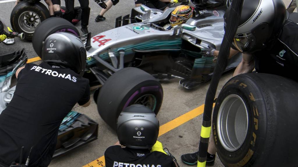 Lewis Hamilton has his tyres changed