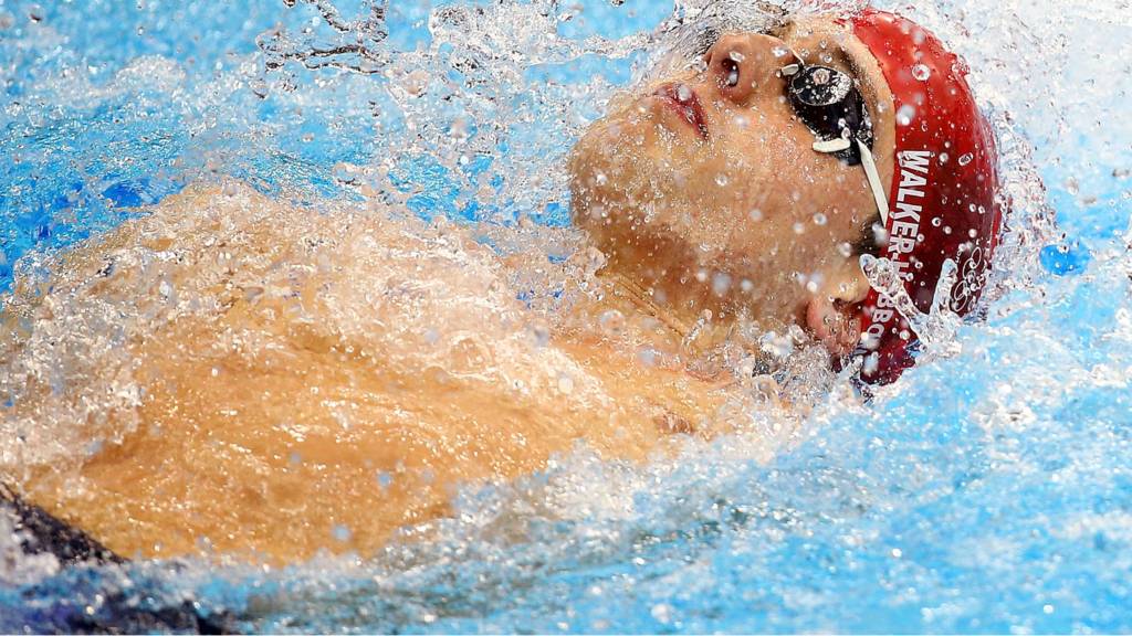 man swimming as woman