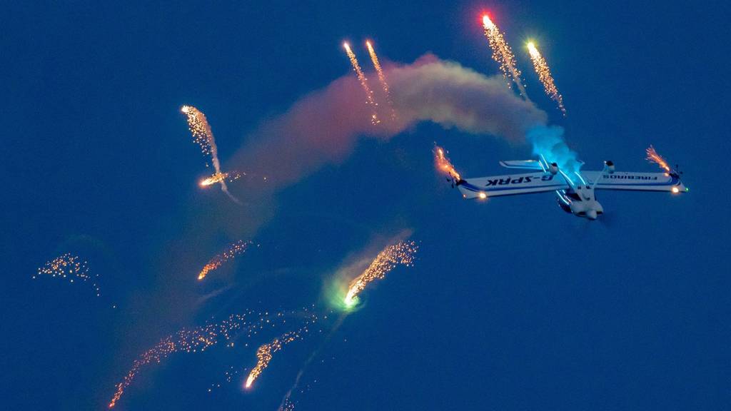 Firebird aircraft at night with fireworks