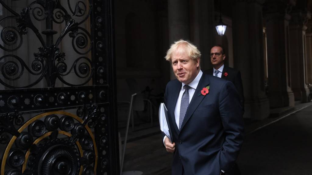 Boris Johnson leaves a Cabinet meeting in 2020, followed by his then private secretary Martin Reynolds