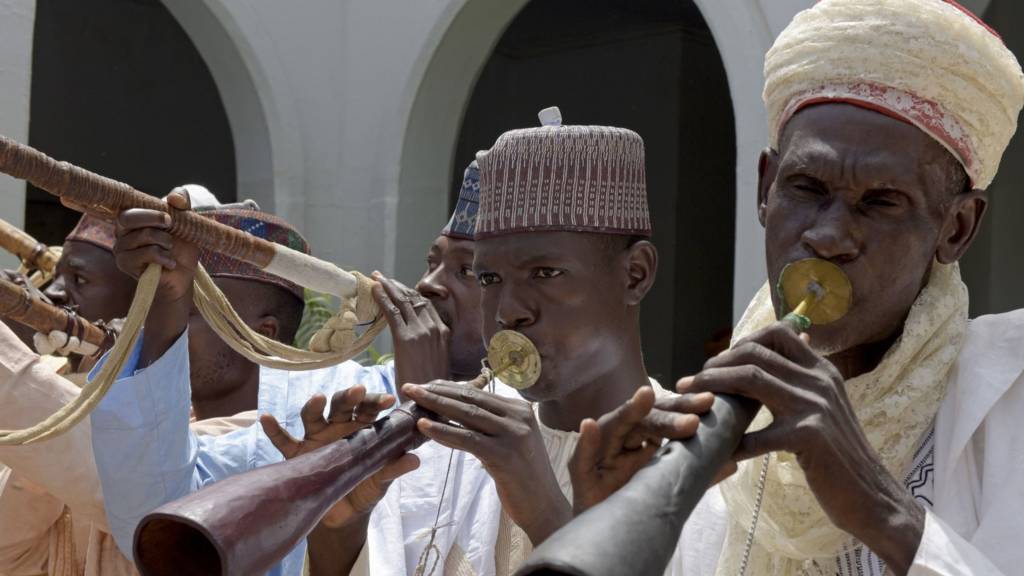 Men playing traditional instrument