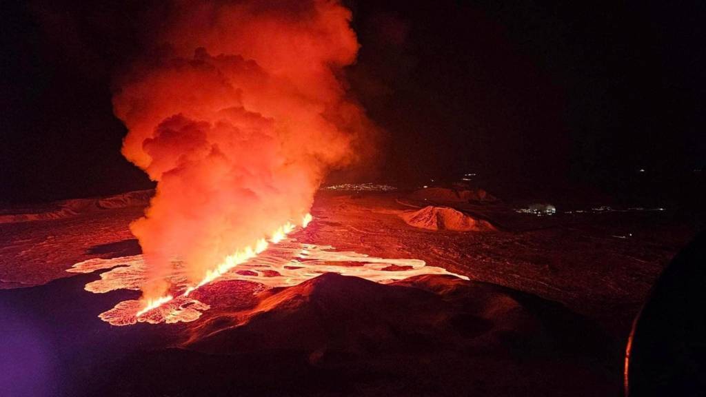 A volcano spews lava and smoke as it erupts on Reykjanes Peninsula, Iceland