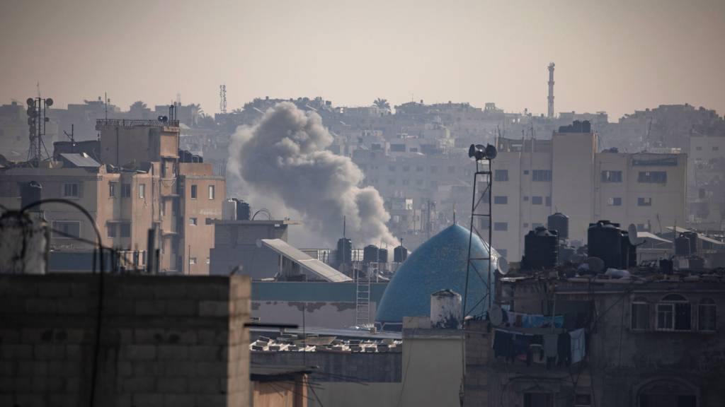 Smoke rises following Israeli air strikes on Khan Yunis, southern Gaza Strip, 8 January