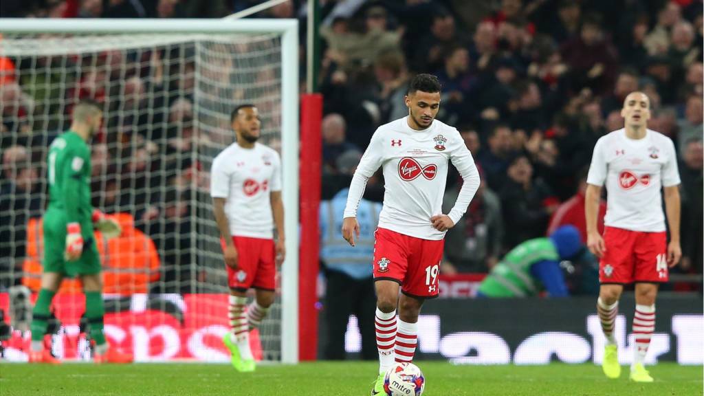 Sofiane Boufal of Southampton and team mates look dejected