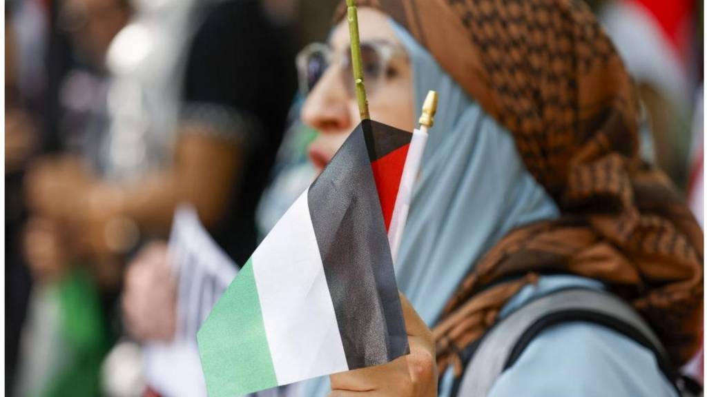 Woman with Palestinian flag