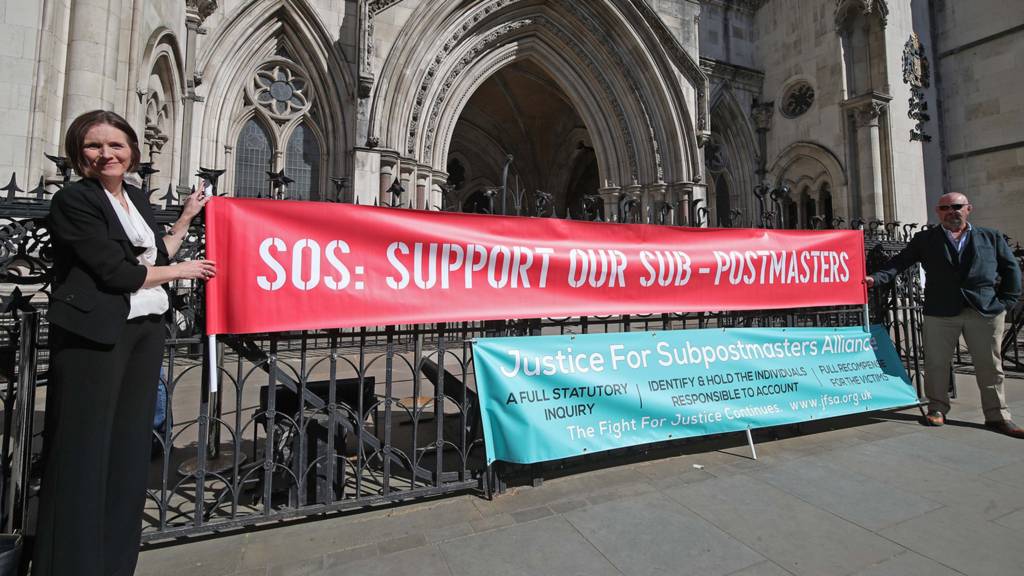 Protesters outside the Royal Courts of Justice in London, where dozens of former sub-postmasters who were convicted of theft, fraud and false accounting, because of the Post Office's defective Horizon accounting system, are expected to finally have their names cleared by the Court of Appeal. 23 April 2021.